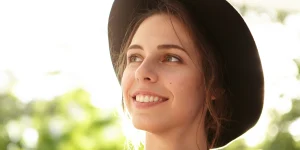 A young woman smiling.