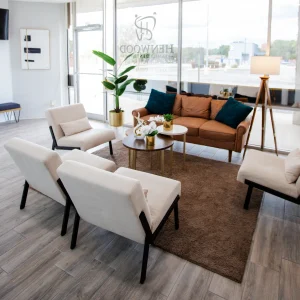 A cozy home room with a comfortable couch and chairs.